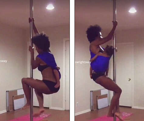  女子跳钢管舞哺乳  双腿交叉双脚完全脱离地面