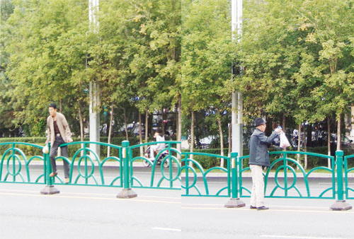 图为跨越护栏的人们.